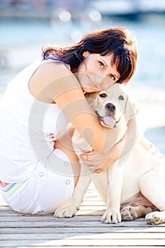 Beautiful woman hugs her dog