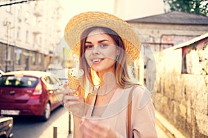 Beautiful woman ice cream walk along the street outdoors charm