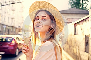 Beautiful woman ice cream walk along the street outdoors charm