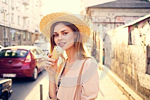 Beautiful woman ice cream walk along the street outdoors charm