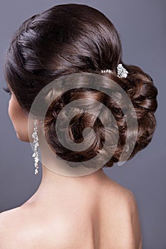 Beautiful woman in image of the bride. Beauty hair. Hairstyle back view