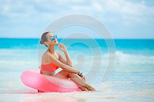 Beautiful woman with inflatable life buoy