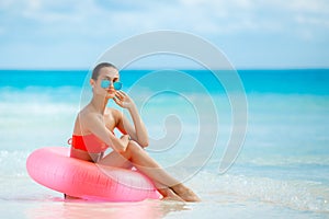 Beautiful woman with inflatable life buoy