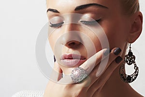 Beautiful woman.Jewelry and Beauty.girl.ornamentation.liquid sand manicure.hairless