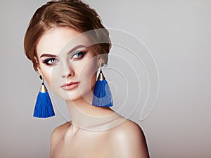 Beautiful Woman with Large Earrings Tassels