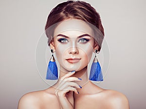Beautiful Woman with Large Earrings Tassels