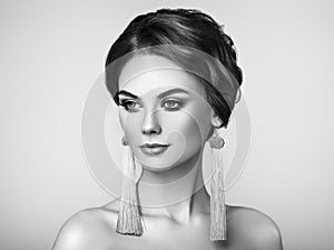Beautiful Woman with Large Earrings Tassels