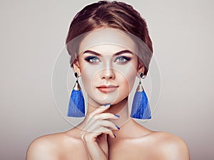 Beautiful Woman with Large Earrings Tassels photo