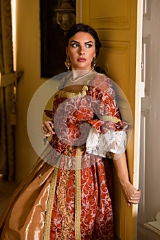 Lady in renaissance gown in door photo