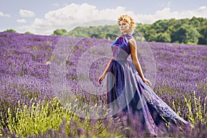 Beautiful woman in lavender fields