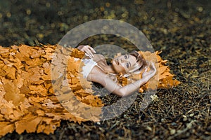 Beautiful woman laying in autumn bed portrait background beauty portrait photoshoot