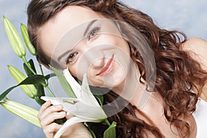 Beautiful woman with a lily flowers