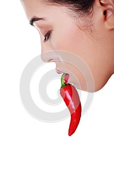 Beautiful woman lips with hot paprika