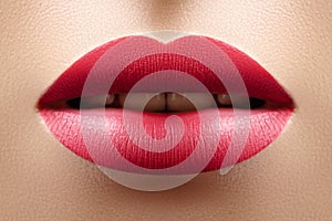 Beautiful Woman Lips with Red Fashion Lipstick Makeup. Fashion cosmetic concept. Beauty Lip Visage. Passionate kiss