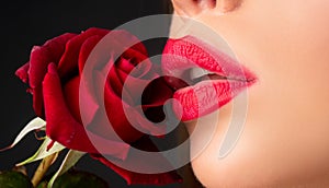 Beautiful woman lips with rose. Lipstick cosmetics makeup, fashion and beauty.