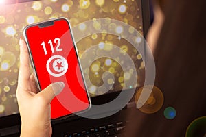 beautiful woman living on the cell phone the flag of turkey with the numbers 112