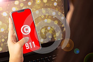 beautiful woman living on the cell phone the flag of turkey with the numbers 911 at the bottom
