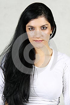 Beautiful woman with long black hair and penetrating look photo