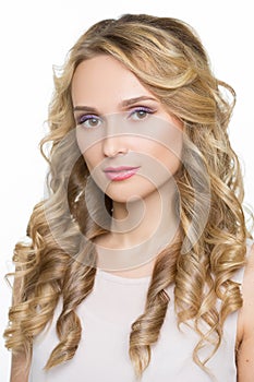 Beautiful woman with long blond curly hair