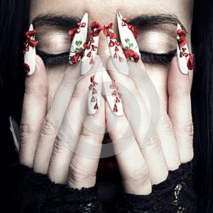 Beautiful woman with long designer nails