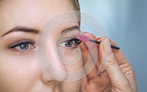 Beautiful Woman with long eyelashes in a beauty salon.