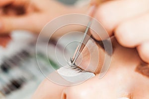 Beautiful woman with long eyelashes in a beauty salon