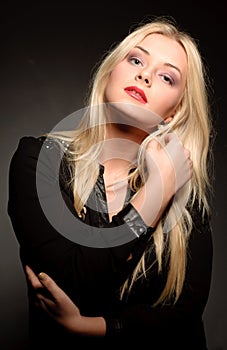Beautiful woman with long straight blond hair. Fashion model