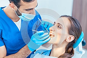 Beautiful woman looking with confidence at her reliable dentist