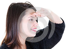 Beautiful woman looking forward with the hand in forehead