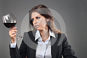 Beautiful woman looking at wineglass