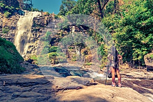 Beautiful woman make photo Mae Ya Waterfall is one of the most beautiful cascades in Doi Inthanon national park, Chiang Mai.