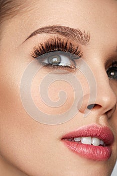 Beautiful Woman With Makeup, Soft Skin And Long Eyelashes