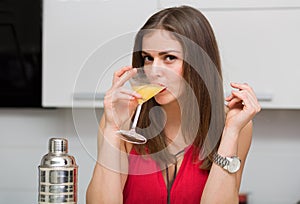 Beautiful woman making a cocktail