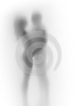 Beautiful woman and man couple together, hugs each other. Body silhouette, behind a curtain.