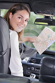 beautiful woman map while planning car trip