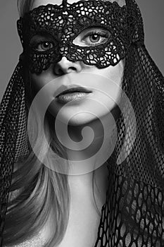 Beautiful Woman in Mask. Black and white portrait