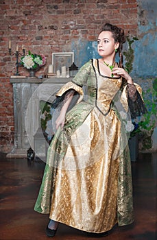 Beautiful woman in medieval dress afraid