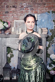 Beautiful woman in medieval dress with fan