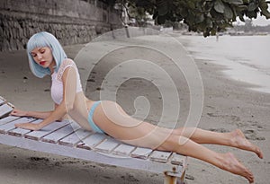 beautiful woman in modern futuristic style posing on the damaged wooden blue sunbed