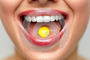 Beautiful Woman Mouth With Pill On Tongue. Girl Taking Medicine