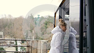 Beautiful woman move in funicular