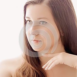 Beautiful woman with natural look, perfect skin and shiny hair as make-up, health and wellness concept. Face portrait of