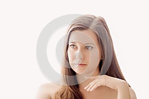 Beautiful woman with natural look, perfect skin and shiny hair as make-up, health and wellness concept. Face portrait of