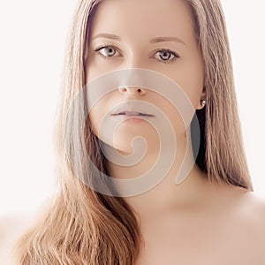 Beautiful woman with natural look, perfect skin and shiny hair as make-up, health and wellness concept. Face portrait of