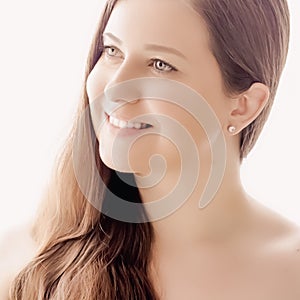 Beautiful woman with natural look, perfect skin and shiny hair as make-up, health and wellness concept. Face portrait of