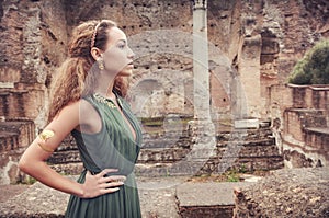 Beautiful woman near ancient ruins