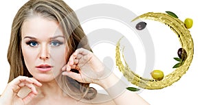 Beautiful woman near circulate olive oil. Skincare concept.