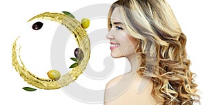 Beautiful woman near circulate olive oil. Skincare concept.