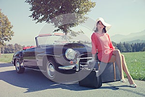 Beautiful woman and old car, sixties style