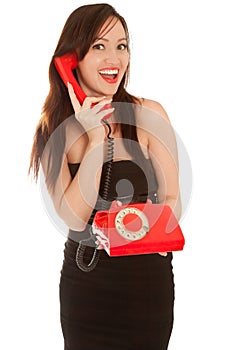 Beautiful woman with old red telephone talking